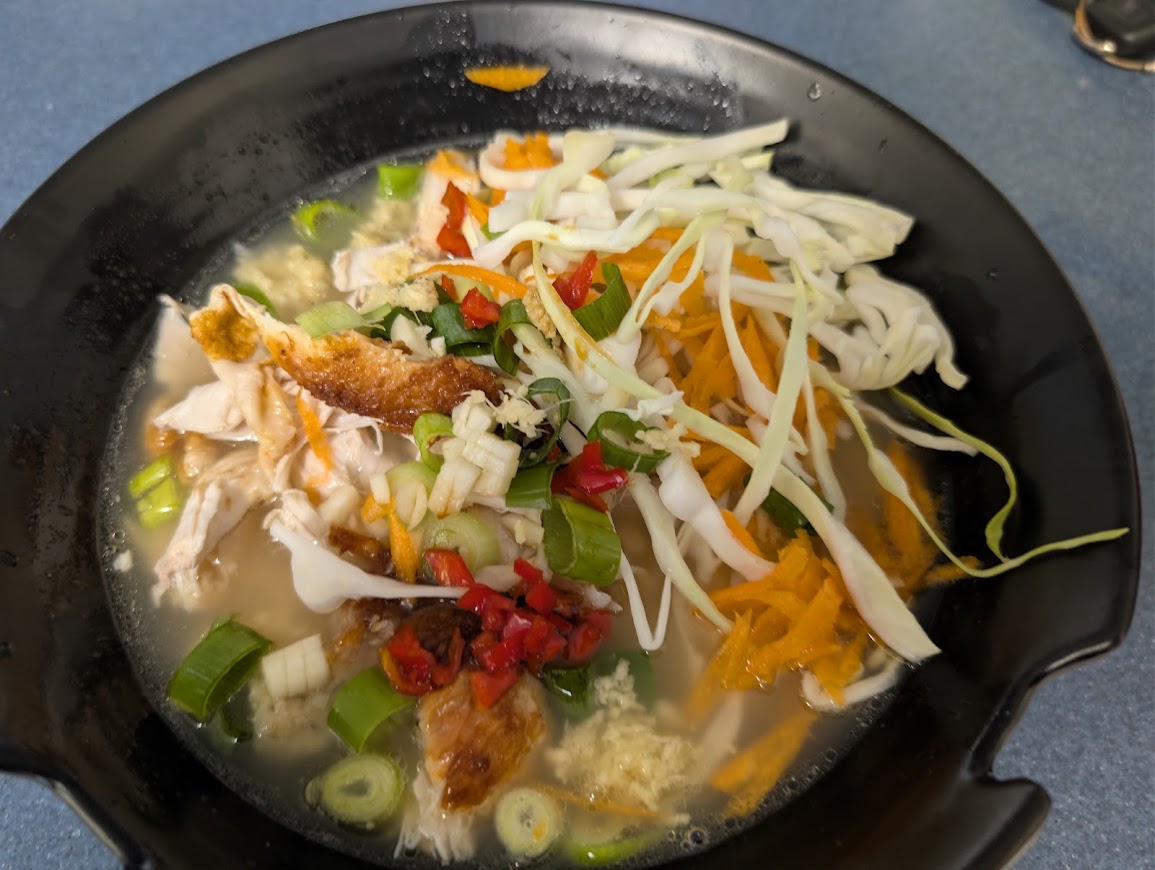 "A finished noodle bowl ready for eating"